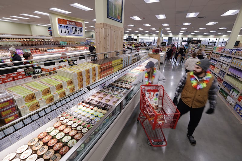 Customers shop for items as Trader Joe’s in Draper opens for business on Friday, March 3, 2023.