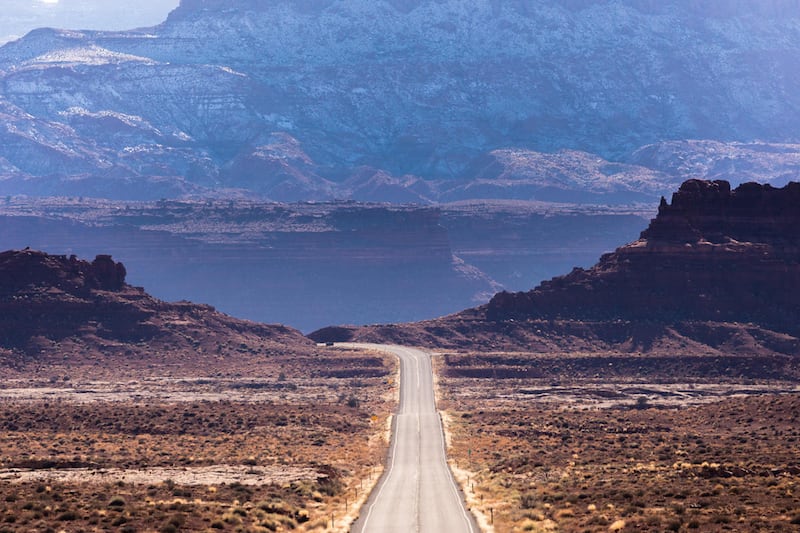 FILE - The view on Utah SR-95, at the edge of Glen Canyon National Recreation Area in San Juan County. A two-year-old ranching dispute involving cattle, a locked gate in San Juan County and criminal case brought against an activist and her husband has now