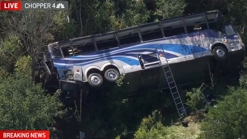 A bus lies on its side where it crashed along Interstate 84, in Wawayanda, N.Y., on Thursday, Sept. 21, 2023.