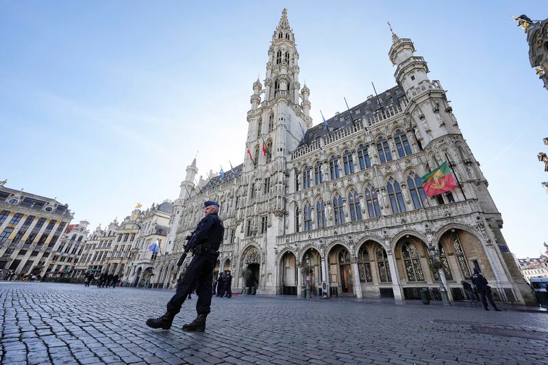 Belgian Police patrol the Grand Place in central Brussels.