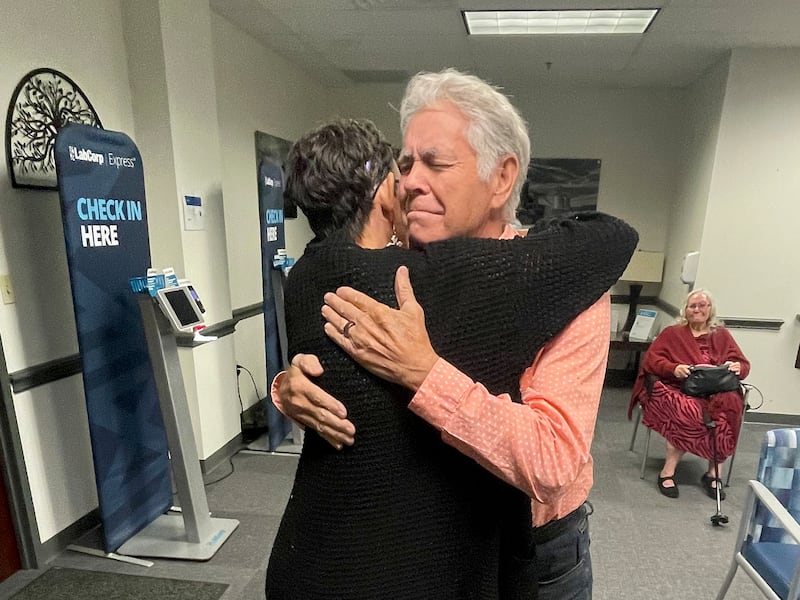 Melissa Highsmith is reunited with her family, including her father, Jeff Highsmith, on Nov. 26, 2022, in Fort Worth, Texas.