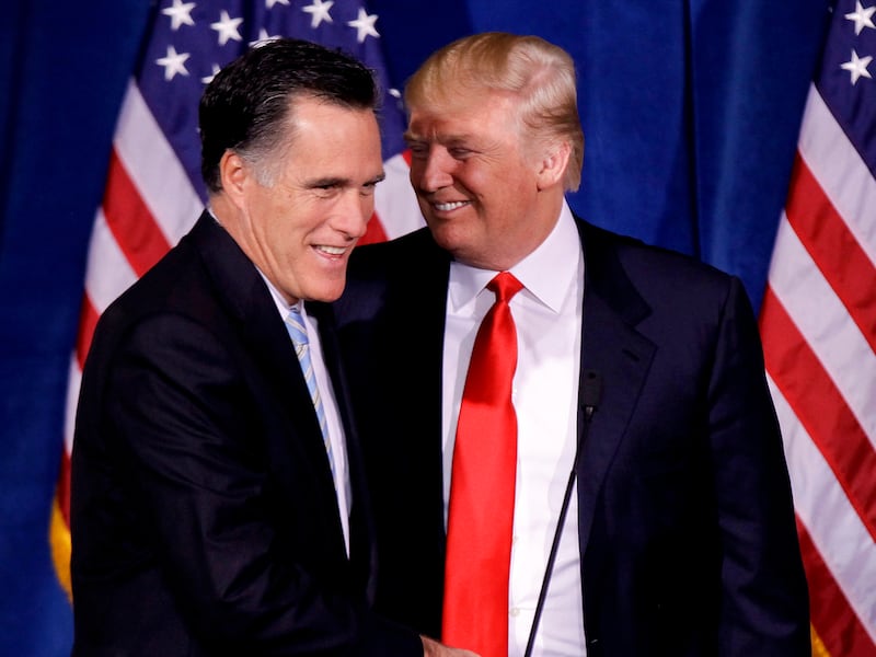 Donald Trump greets Mitt Romney after announcing his endorsement of Romney on Thursday, Feb. 2, 2012, in Las Vegas.