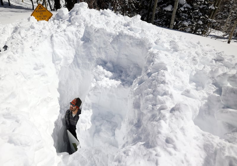 Dave Eiriksson, Natural Resources Conservation Service snow survey hydrologist, stands in a snow pit in Alta on March 16, 2023.