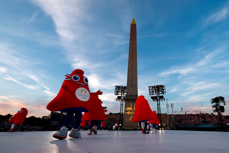 The Paralympic mascot the red triangular-shaped Phryge performs during the Opening Ceremony for the 2024 Paralympics, Wednesday, Aug. 28, 2024, in Paris, France.