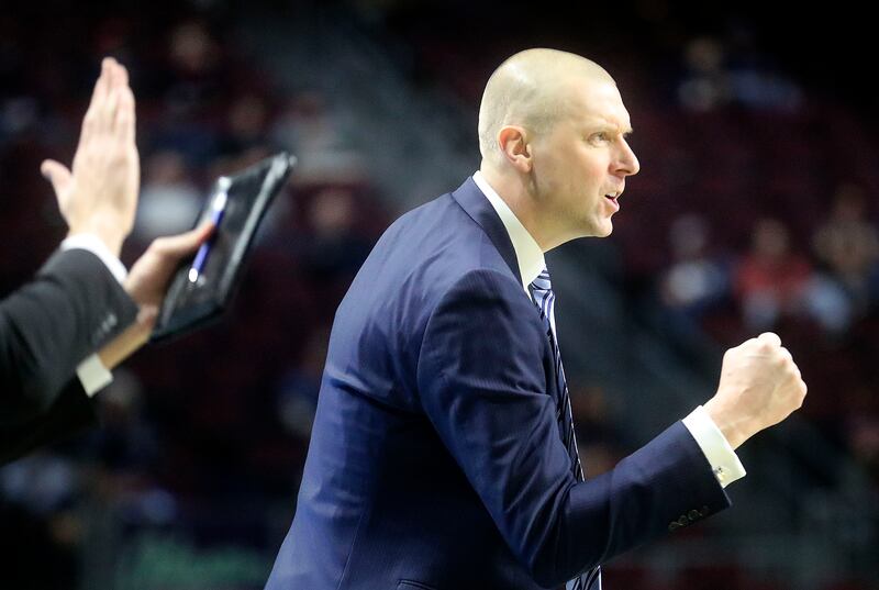 BYU basketball head coach Mark Pope reacts as the Cougars play the Loyola Marymount Lions in the 2022 WCC tournament.