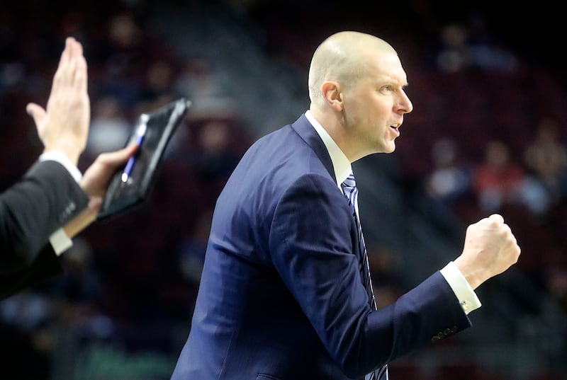 BYU basketball head coach Mark Pope reacts as the Cougars play the Loyola Marymount Lions in the 2022 WCC tournament.