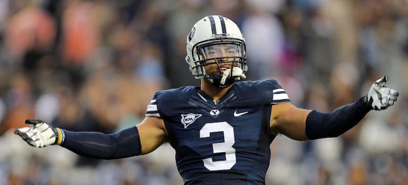 BYU linebacker Kyle Van Noy motions to the crowd during a game against Texas on Sept. 7, 2013, at LaVell Edwards Stadium.