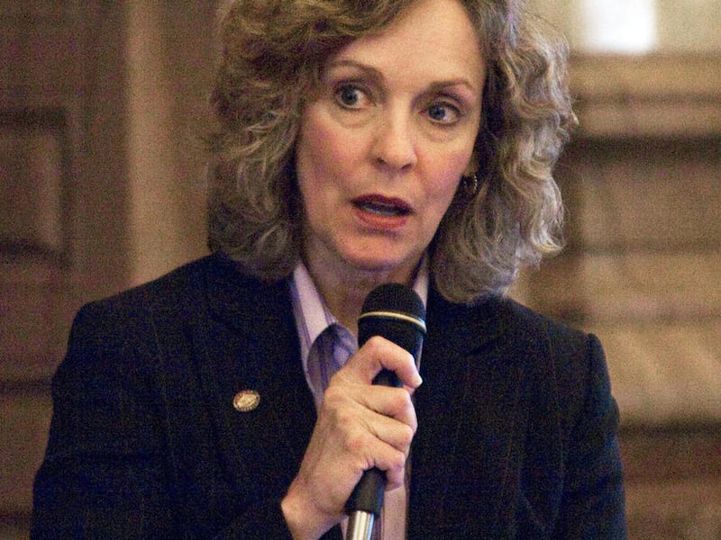 FILE - In this Tuesday, May, 6, 2008 file photograph, then-Senator Karin Brownlee, R-Olathe rises in support of a bill that would marry the construction of two new coal fired plants in the southwest area of the state to other economic development projects