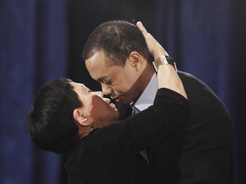 Tiger Woods hugs and kisses his mother, Kultida Woods, during a news conference Feb. 19 in Ponte Vedra Beach, Fla. Tiger will return to professional golf April 8 at the Masters.