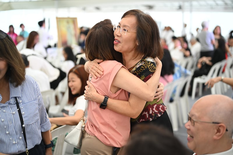 Two women hugging.