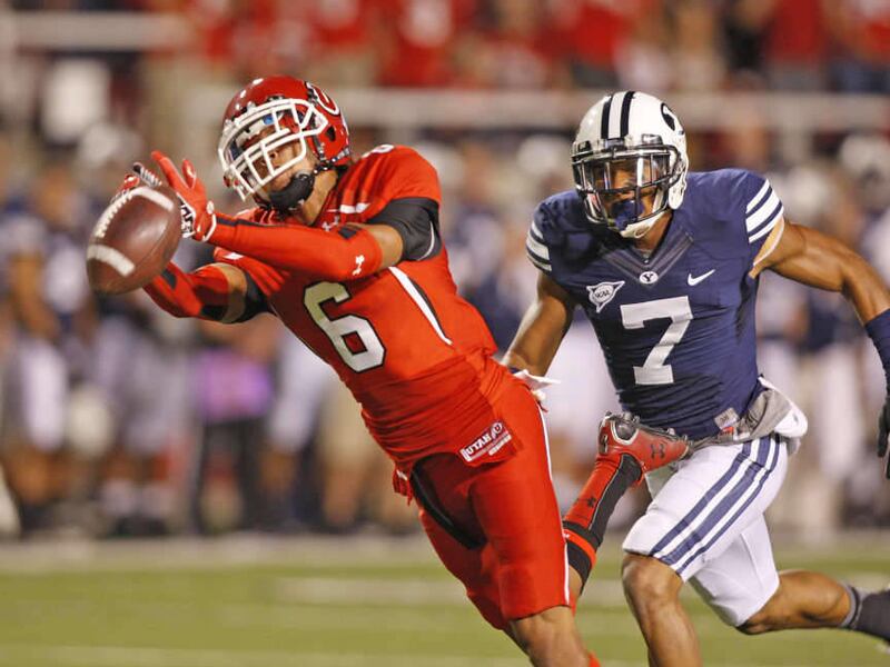Utah Utes wide receiver Dres Anderson (6) barely misses a catch as Brigham Young Cougars defensive back Preston Hadley defends during the first half as the University of Utah and BYU play football Saturday, Sept. 15, 2012, in Salt Lake City, Utah.
