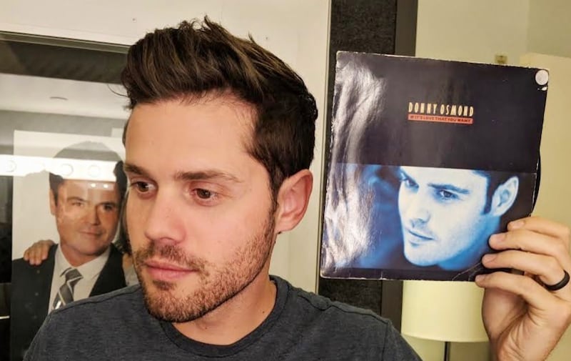 Donny Osmond posted a photo on Instagram of his youngest son, Chris, holding an old record of Donny's.