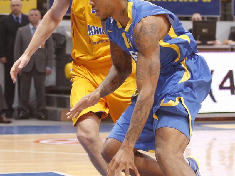 Maccabi Electra's Malcolm Thomas, right, goes to score past BC Khimki's Matt Nielsen during their the Euroleague Top 16 Group F basketball match in Khimki, outside Moscow,, Russia, Friday, Jan. 18, 2013. Thomas, who signed with the Jazz on Jan. 25, was se