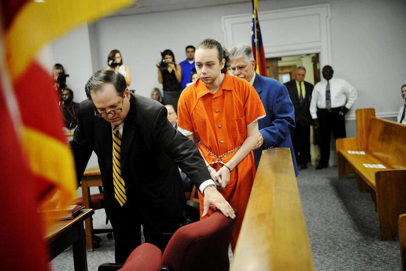 Stephen McDaniel is led to his seat in a magistrate courtroom in the Bibb County Courthouse in Macon, Ga. before his commitment hearing Friday morning, Aug. 26, 2011. After the hearing in which some, but not all, of the evidence against McDaniel was aired