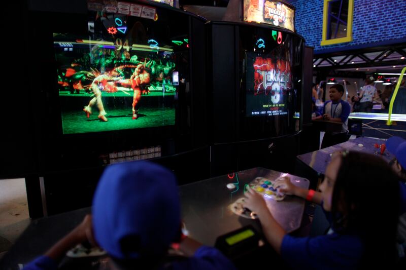 Children play a video game in Caracas.