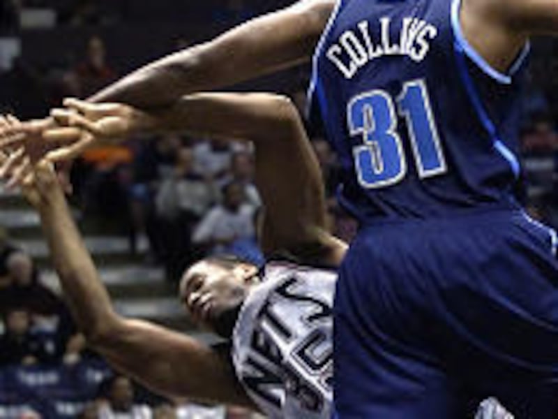 Jason, left, and Jarron Collins collide during the Nets' victory over the Jazz on Wednesday. The twins have faced off five times in the NBA.