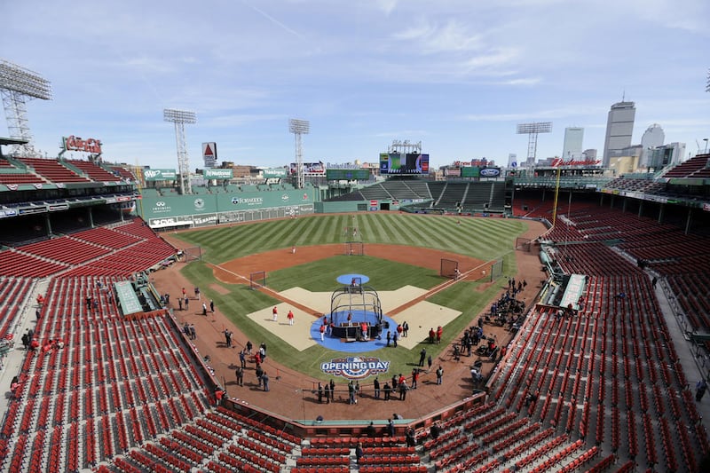 Boston Red Sox players surround the batting cage during pre-game warm-ups before the Red Sox baseball Home Opener against the Pittsburgh Pirates at Fenway Park, Monday, April 3, 2017, in Boston. (AP Photo/Elise Amendola)
