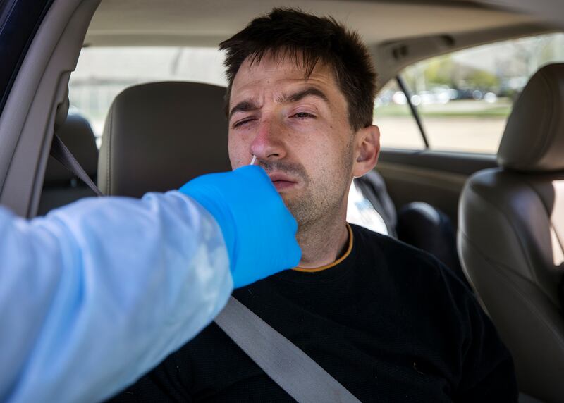 David Kartchner receives a COVID-19 test in Salt Lake City.