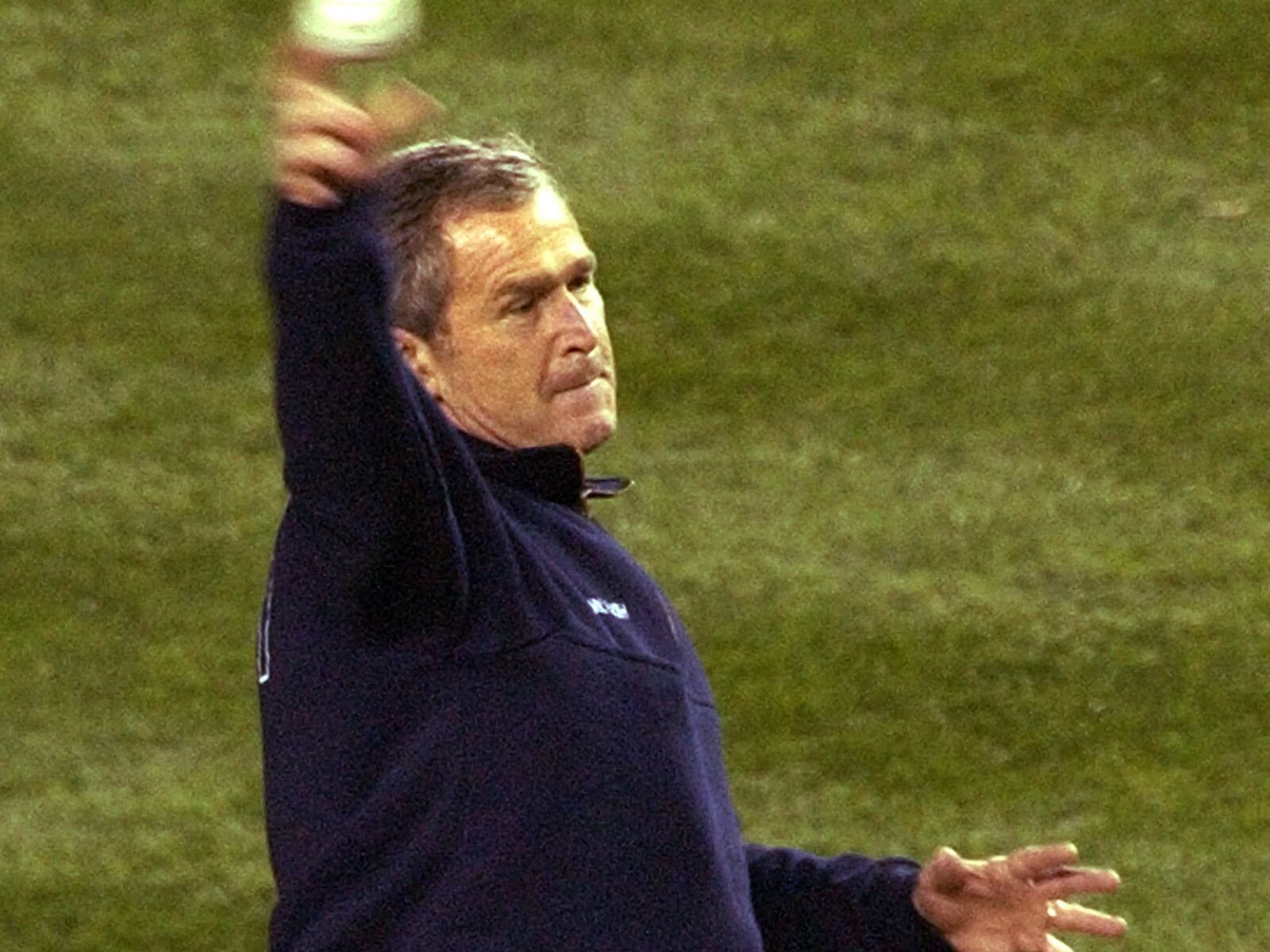 President George Bush throws out the ceremonial first pitch for Game 3 of the World series onb Oct. 30, 2001.