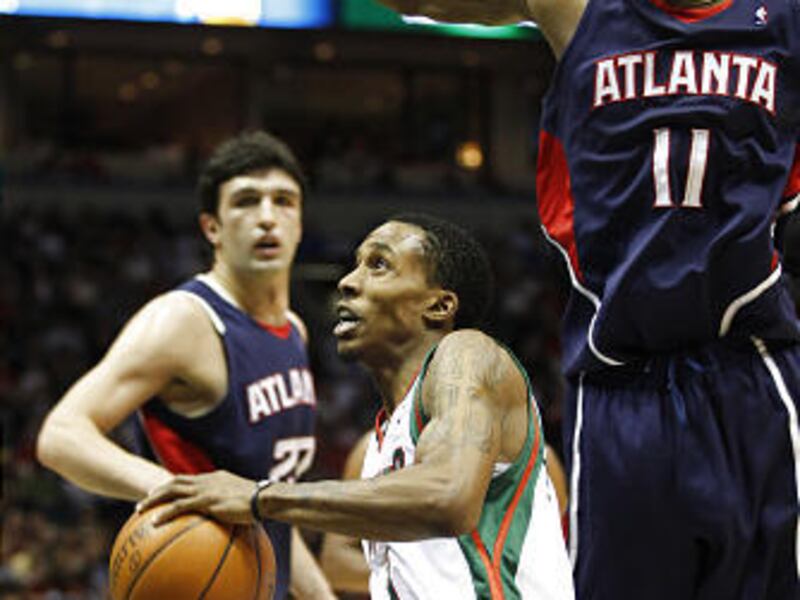 Milwaukee's Brandon Jennings drives against Atlanta's Jamal Crawford.
