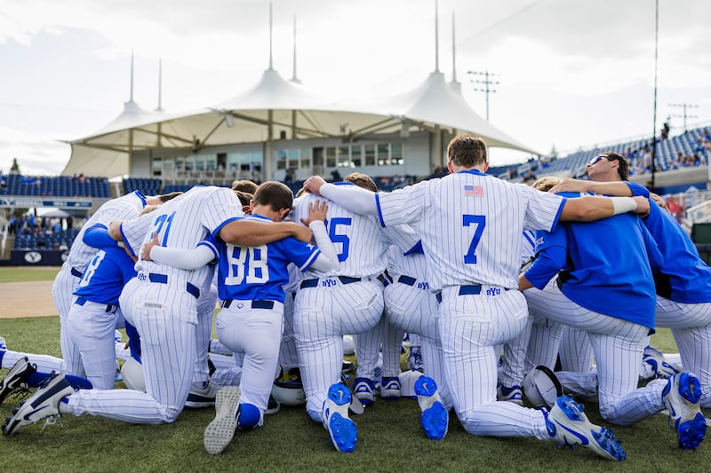 BYU players take a knee prior to game against Texas Tech May 16, 2026 at Miller Park in Provo.