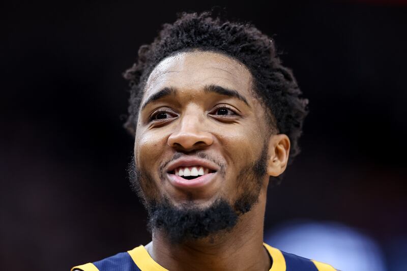 Utah Jazz guard Donovan Mitchell (45) smiles on during a game against the Orlando Magic in Salt Lake City on Feb. 11, 2022.