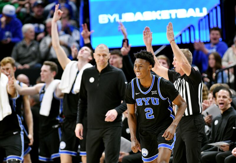 BYU Cougars guard Jaxson Robinson (2) smiles after dropping in a 3-point shot as BYU and Fresno State play at the Delta Center.