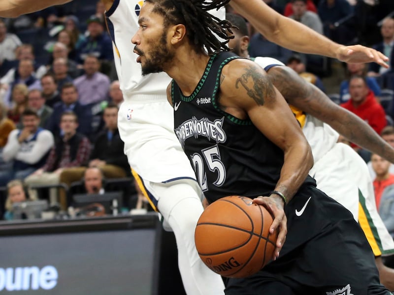 Minnesota Timberwolves' Derrick Rose drives around Utah Jazz's Rudy Gobert during the second half of an NBA basketball game Wednesday, Oct. 31, 2018, in Minneapolis. Rose led the Timberwolves with 50 points, a career high, in the Timberwolves' 128-125 win