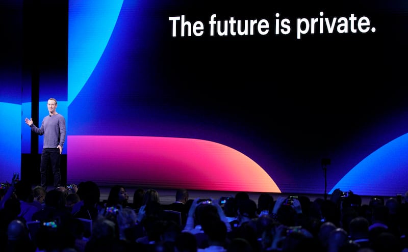 FILE - In this April 30, 2019 file photo, Facebook CEO Mark Zuckerberg, left, makes the keynote speech at F8, the Facebook's developer conference, in San Jose, Calif. Facebook's stock is plunging following a Wall Street Journal report that the Federal Tra