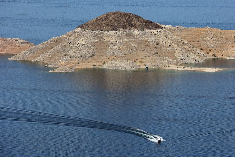 A boat cruises in Hemenway Harbor on Lake Mead.