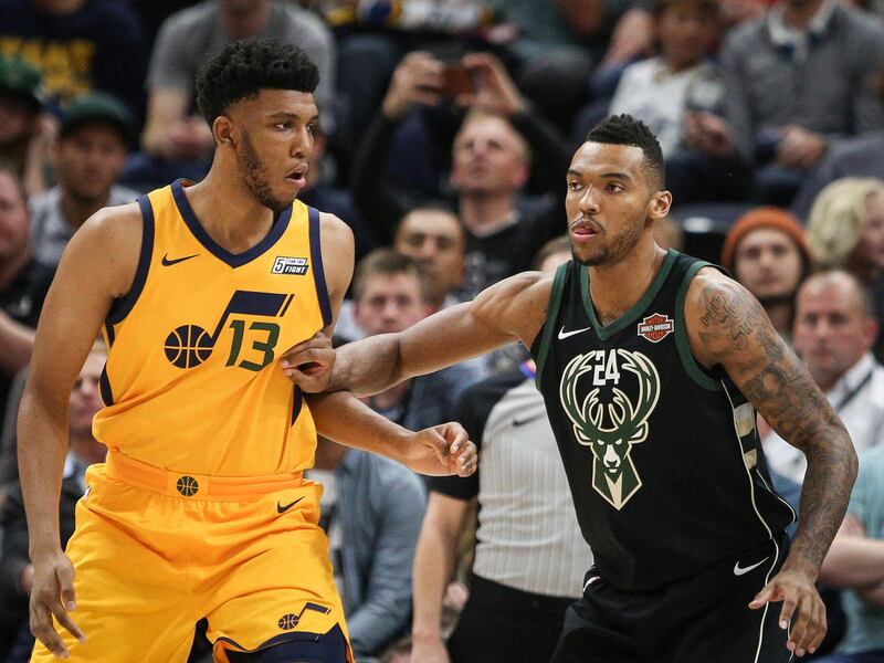 Milwaukee Bucks forward Joel Bolomboy (24) fights for position with Utah Jazz center Tony Bradley (13) as the Utah Jazz host the Milwaukee Bucks at Vivint Smart Home Arena in Salt Lake on Saturday, Nov. 25, 2017.