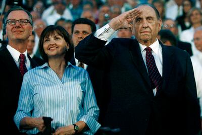 President Thomas S. Monson salutes as he and his daughter, Sister Ann Dibb, second counselor in the general Young Women's presidency (center), and her husband, Roger, attend the cultural celebration for the Twin Falls Idaho Temple on Aug. 23, 2008.