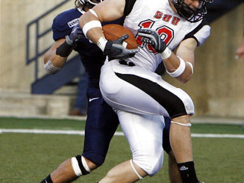 Southern Utah's Tysson Poots, right, scores on a touchdown pass in last week's game against USU.