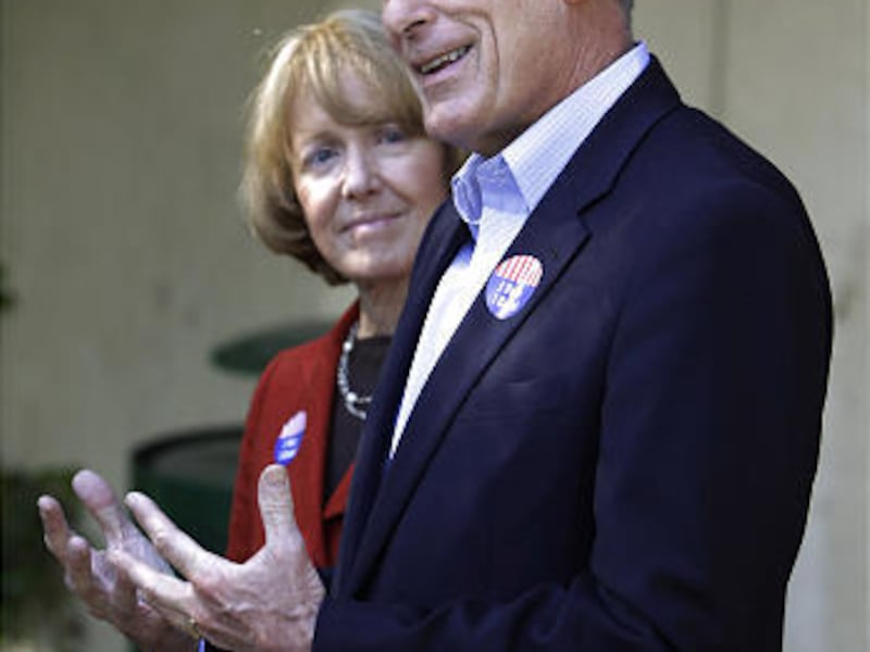 Republican Senate candidate Dan Coats speaks as his wife, Marsha, listens.