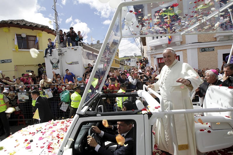 Pope Francis waves to the faithful while riding on a Jeep popemobile in El Quinche, Ecuador, on July 8, 2015. Photo courtesy of REUTERS/Guillermo Granja
*Editors: This photo may only be republished with RNS-POPE-MOBILE, originally transmitted on September