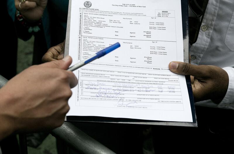 The marriage license for David Turley and Peter Thiede is shown after the couple signed it, Sunday, June 28, 2015 in front of New York's Stonewall Inn. Friday the U.S. Supreme Court legalized gay marriage across the 50 states.