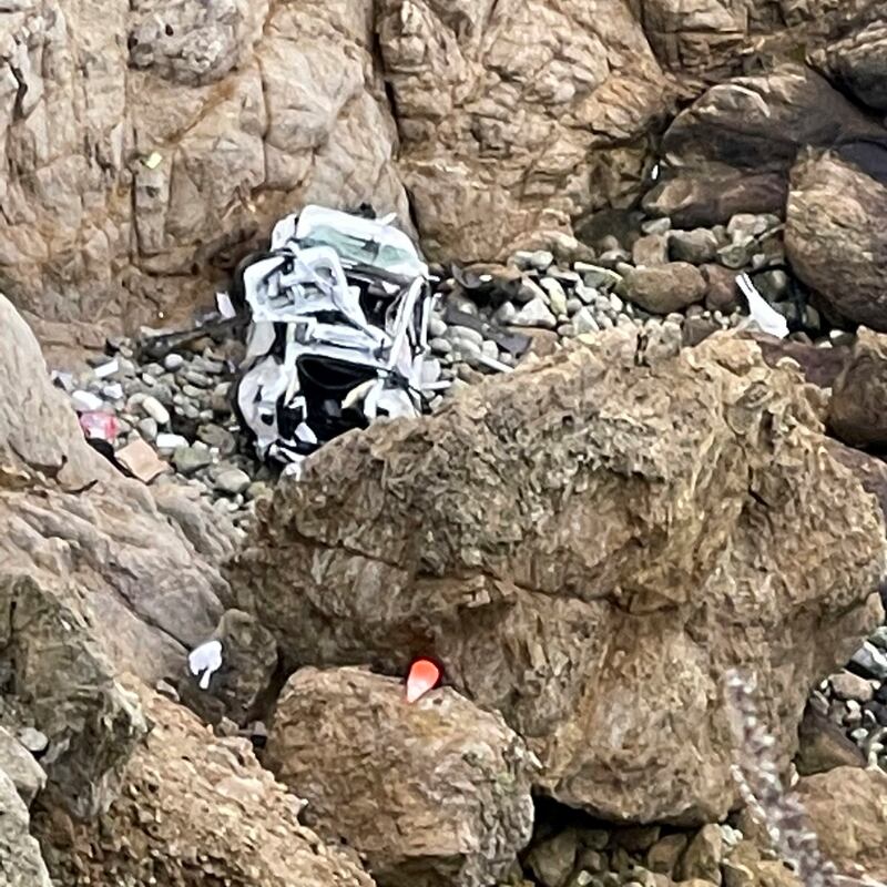 A Tesla vehicle that plunged off a Northern California cliff along the Pacific Coast Highway.