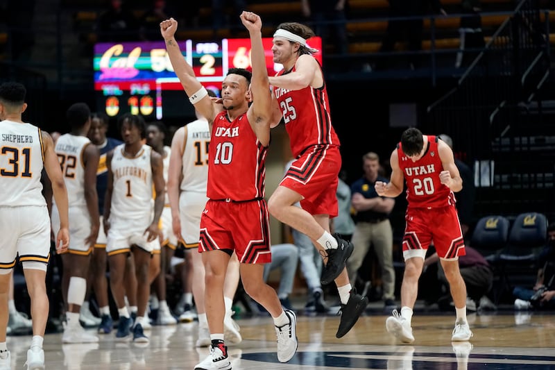 Utah guard Marco Anthony (10) celebrates with guard Rollie Worster (25) and guard Lazar Stefanovic (20) after Utah defeated California.