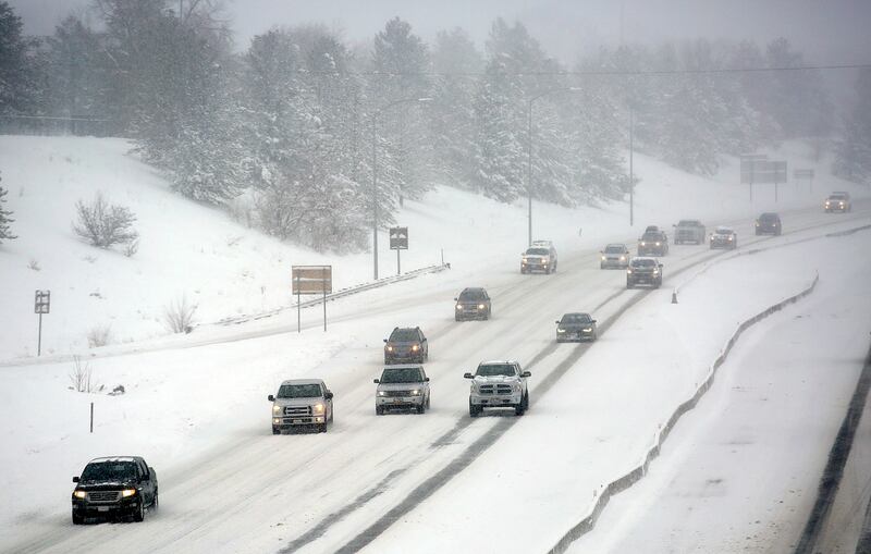 Traffic moves along I-80 during a snowstorm in Salt Lake City on Wednesday, Feb. 6, 2019.