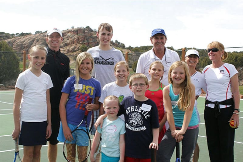 Cliff Drysdale, back row with blue hat, and students at his new tennis school at the Red Ledges resort in Heber City. The legendary player has opened a state-of-the-art facility.