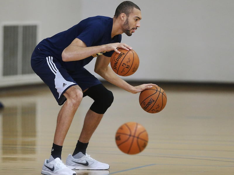 Utah Jazz center Rudy Gobert (27) dribbles as Jazz players practice at UCLA in Los Angeles on Monday, April 17, 2017.