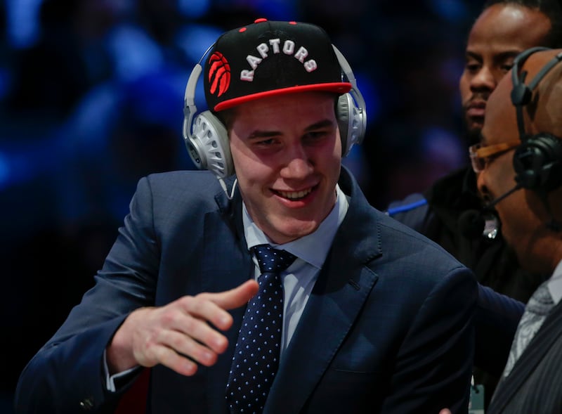 Jakob Poeltl answers questions during an interview after being selected ninth overall by the Toronto Raptors during the NBA basketball draft, Thursday, June 23, 2016, in New York.