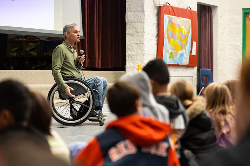 Chris Waddell, a former Paralympian, speaks to students at McPolin Elementary in Park City on Tuesday, Dec. 12, 2023.