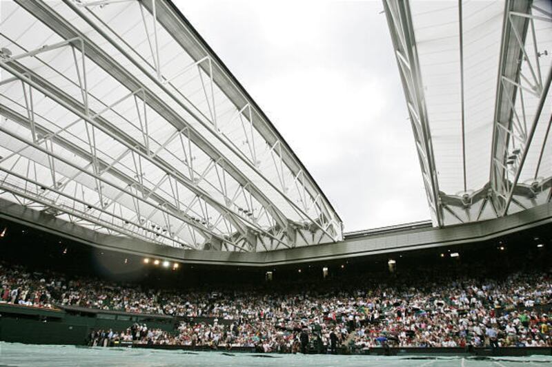 The roof on Centre Court closes during a break in play between Dinara Safina of Russia and Amelie Mauresmo of France on Monday.