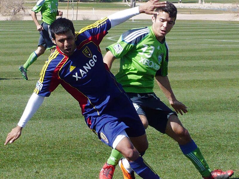 Javier Morales of Real Salt Lake battles for the ball against the Seattle Sounders in preseason action in Arizona Tuesday, February 8, 2011.