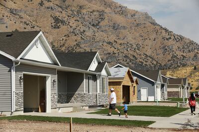 Homes line a street in Hyrum as residents celebrate the completion of the 400th home in northern Utah through Neighborhood Housing Solutions' Owner-Builder Program. Ten families worked together to build their homes, committing to over 35 hours a week on t