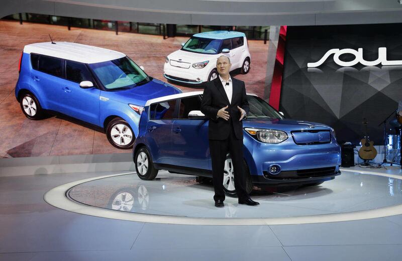 FILE- In this Feb. 6, 2014, file photo, Orth Hedrick, vice president of product planning at Kia, introduces the 2015 Soul EV during the media preview of the Chicago Auto Show at McCormick Place in Chicago. The Soul has a travel range of nearly 100 miles o