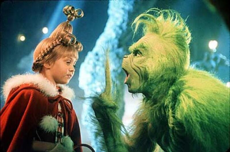 A young Who is lectured by the Grinch (Jim Carrey) in the live-action film "Dr. Seuss' How the Grinch Stole Christmas."