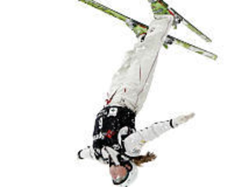 Jamie Myers flips and twists through the air on her first run at the U.S. National Aerial Championship at the Utah Olympic Park on Friday.