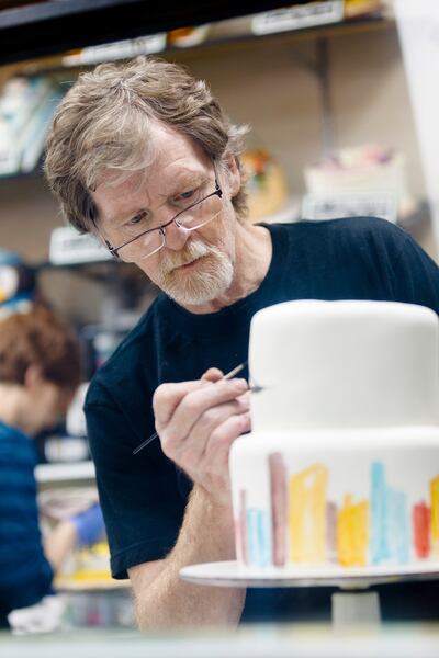 FILE - Jack Phillips, owner of Masterpiece Cakeshop in Lakewood, CO decorates a cake for a client on Sept. 21, 2017.